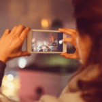 woman taking a photo with phone