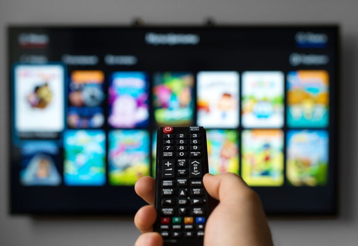 ctv blog post image about user holding remote with tv